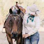 A bay roan Quarter Horse in western tack facing the camera. Her owner stands beside her in a western outfit, her hat obscures her face. Photographed by Trace Digital Photography in the Lockyer Valley.